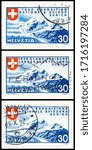 Small photo of SEATTLE WASHINGTON - April 27, 2020: Alpine scenery on 1939 30 centime stamps commemorating Swiss National Exposition. Scott # 249, 252 and 255