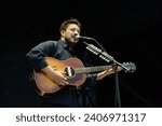 Small photo of Tampa, Florida - March 19, 2023: Mumford and Sons lead singer Marcus Mumford performs at the 2023 Innings Music Festival in Tampa Bay, Florida.