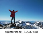 Girl over a snowcapped peaks with outstretched arms