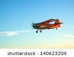 Red Vintage Airplane Flying