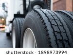 Small photo of Large tread with grooves and special pattern for durable traction on big rig semi truck tractor tires on paired wheels ensures safe grip when transporting heavy cargo at any weather condition