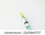 Small photo of Steel dental syringe for local anesthesia, isolated on white. Carpool syringe for anesthesia in dentistry. Thin needle on a syringe for anesthesia in dentistry.