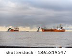 Two Vessels Engaged In Dredging....