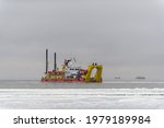Vessel Engaged In Dredging At...