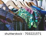 summer clothes on hangers with swquins