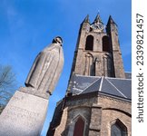 Small photo of DELFT,HOLLAND-JULY 30,2023: Statue of Saint Geertruyt Van Oosten in front of the Old Church. Gertrude van der Oosten was a Dutch Beguine who was considered a mystic and had received the Stigmata.