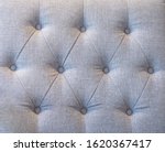 Upholstery Fabric sofa backrest with fabric button tufting grey color, Luxury background interior and  furniture design.