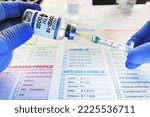 Small photo of Syringe and vial of coronavirus vaccine labeled with the fourth dose on the label for vaccination of patients. hands of a doctor dosing into the syringe dose of the fourth dose of the COVID-19 vaccine