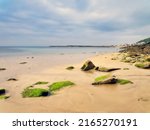 A Seascape At Low Tide With...