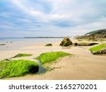 A Seascape At Low Tide With...