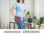 Hip joint pain, woman suffering from osteoarthritis at home, health problems concept