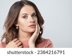 Small photo of Pretty female face with natural clear skin without retouch. Young perfect brunette woman without retouching, closeup studio portrait