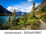 This is a view of one of the 3 Grinnell lakes and surrounding mountains, taken from the Grinnell Glacier Trail in the Many Glacier area of Glacier National Park in Montana.