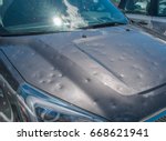 Dented car after a big hail storm