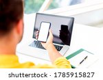 Small photo of Cropped shot of a businessman using a mobile phone at his desk in an office. White fullscreen.