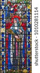 Small photo of LONDON, GREAT BRITAIN - SEPTEMBER 16, 2017: The St. Brigid of Kildare on the stained glass in church St Etheldreda by Joseph Edward.Nuttgens (1952).
