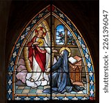 Small photo of BIELLA, ITALY - JULY 15, 2022: The apparition of apparition of Heart Jesus to St. Theresa of Avila in the stained glass of Duomo from 19. cent.