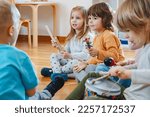 Small photo of Preschool children with instruments in a music class