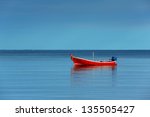 Red Boat Single Row On Sea With ...