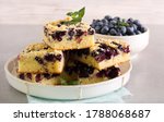 Small photo of Blueberry crumble topping coffeecake, sliced on plate
