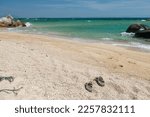 Flip Flops On Sand Beach With...
