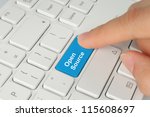 Hand pushing blue open source keyboard button