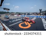 Small photo of July 17, 2023 - Loudon, NH, USA: NASCAR Cup Driver Christopher Bell (20) races for position for the Crayon 301 at the New Hampshire Motor Speedway in Loudon NH.