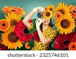 A young woman styled in a 50's fashion, capturing memories with a vintage film camera. Her face is partially covered by surreal, oversized flowers, surrounded by an arrangement of blossoms.