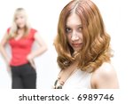 Small photo of Brunette girl outstrip blond colleague