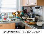 Compulsive Hoarding Syndrom - messy kitchen with pile of dirty dishes