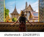 Asian woman traveller take a photo and travel in Bangkok grand palace and wat phra kaew in Bangkok city, Thailand