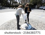 Small photo of Nova Gorica, Slovenia - April 03, 2021: Family Members Meet at Europa Square Symbol of European Open Borders that is Between Nova Gorica in Slovenia and Gorizia in Italy to exchange some words and som