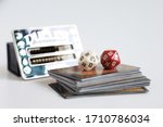 Small photo of AYUTTHAYA,THAILAND-APRIL 22, 2020 : MAGIC THE GATHERING CARD, MTG GAME CARD DICES, DUELIST LIFE COUNT ACCESSORIRES AND LIBRARY CARD ON WHITE BACKGROUND