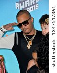 Small photo of LOS ANGELES, CA. March 23, 2019: T.I. & Heiress Diana Harris at Nickelodeon's Kids' Choice Awards 2019 at USC's Galen Center. Picture: Paul Smith/Featureflash