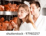 Young couple inhaling essential oil in salt cave of a Spa