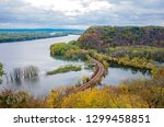 above mississippi river and woodlands during autumn at iowa border and wisconsin in distance