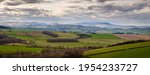 Small photo of Panorama of the Cheviot Hills, a range of rolling hills straddling the Anglo-Scottish border viewed here from Corby's Crags in early springtime