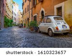 Cozy old street in Trastevere in Rome, Italy. Trastevere is rione of Rome, on the west bank of the Tiber in Rome, Lazio, Italy.  Architecture and landmark of Rome