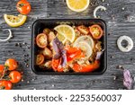 Small photo of A dish in a black disposable container from catering on a concrete background, dietary catering, ready meals with you, healthy food