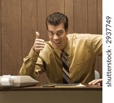 Small photo of Caucasion mid-adult retro businessman sitting at desk giving overenthusiastic thumbs up.