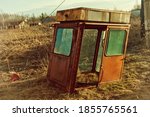 Small photo of View of an old abandoned trailer in the countryside. An image of decrepitude or natural disaster.