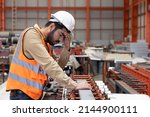 Small photo of Sick Industrial Engineer Worker Touch His Forehead with Dizziness Symtom
