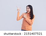 isolated asian woman pointing... | Shutterstock . vector #2151407521