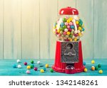 Carousel Gumball Machine Bank on a wooden background