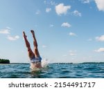 Person Diving Into The Water ...