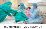 Small photo of asian pregnant woman in delivery room is preparing to give birth and husband is comforting her in hospital