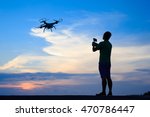 Silhouette of Happy man use drones outdoor with sunset, male