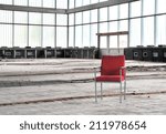 Red chair in an abandoned dilapidated event room