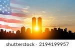 New York skyline silhouette with Twin Towers and USA flag at sunset. 09.11.2001 American Patriot Day banner. NYC World Trade Center.
