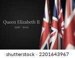 Small photo of UNITED KINGDOM, SEPTEMBER - 8, 2022: National flags of United Kingdom with text Queen Elizabeth II and year of death on black background.